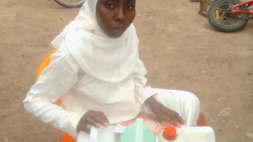 Sakina Ansah of Central Region, Ghana, showing her hand sanitiser and other detergent products, which are used in local hospitals.